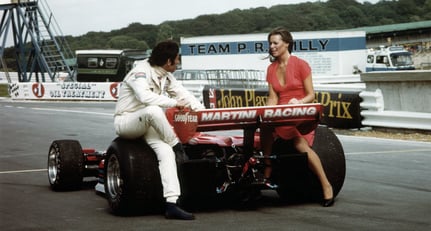 Carlos Pace with a friend and the Brabham-Alfa Romeo BT45 at the British Grand Prix in Brands Hatch, 1976.