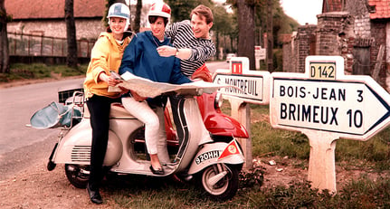 1960&#039;s, A couple astride a Vespa motorscooter ask for directions whilst touring France (Photo by Popperfoto/Getty Images)