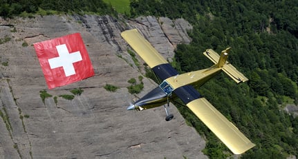 PC-6 &#039;Goldeneye&#039; flying over the Swiss flag