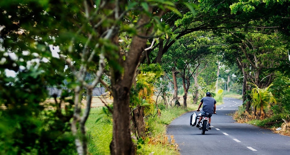 This Honda  Super Cub is the coolest surfboard hauler 